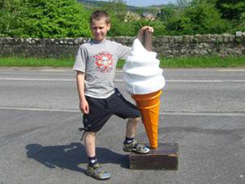 Small boy with large ice cream cone!